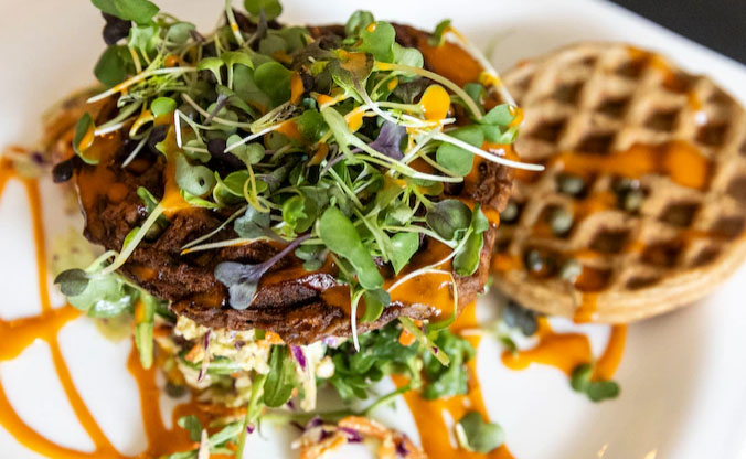 A vegan waffle burger is served at a Michigan restaurant in this file photo. Isaac Ritchey | iritchey@mlive.com